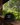A black snapback cap with white embroidered text reading 'Lonesome Seven' and a horse logo, resting on a wooden railing with a forest background visible through an opening.